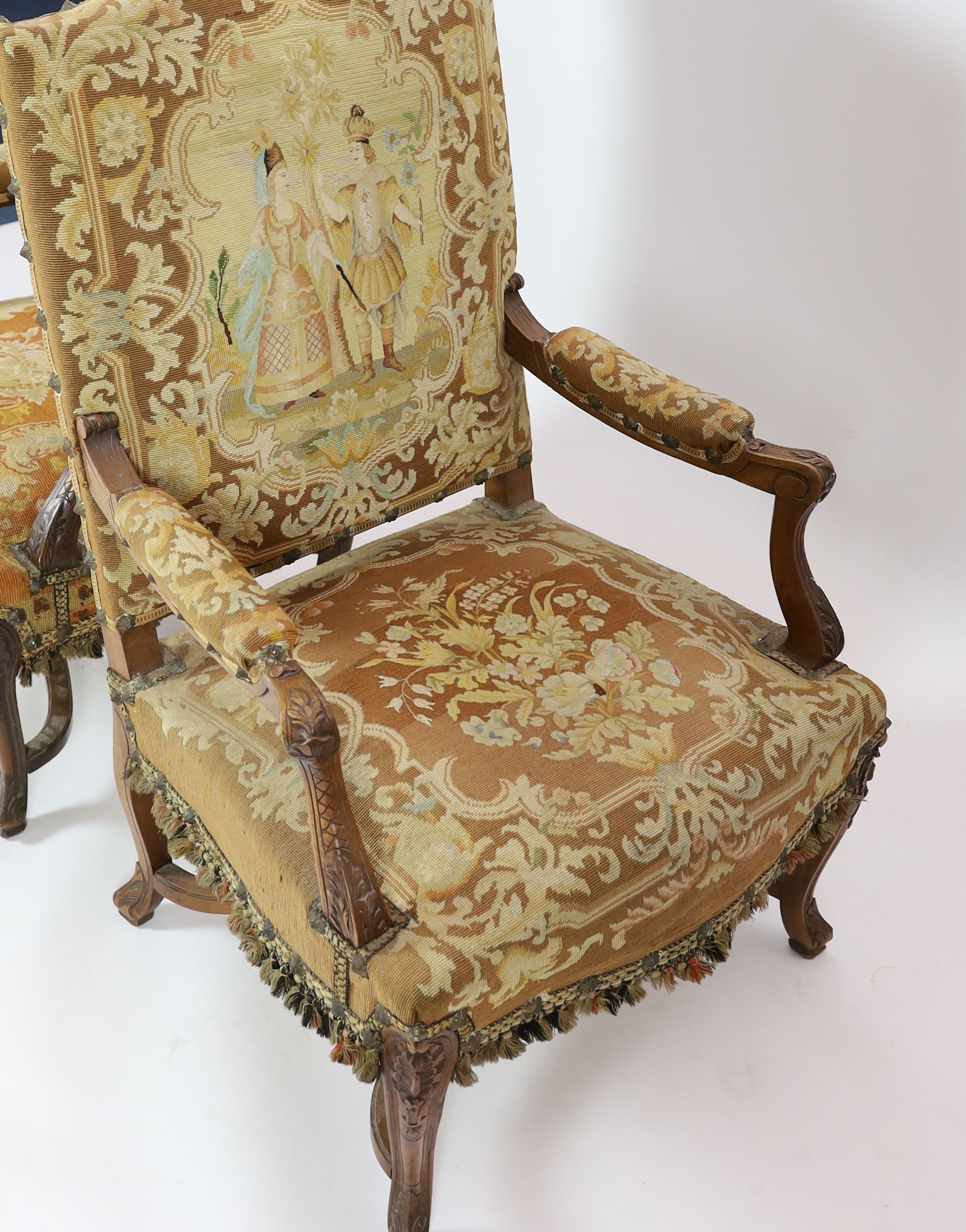 A pair of 19th century French walnut fauteuils W. 75cm. D. 78cm. H. 112cm.